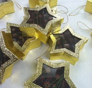 ginger honey snap cookies in decorate ornamental star shaped boxes