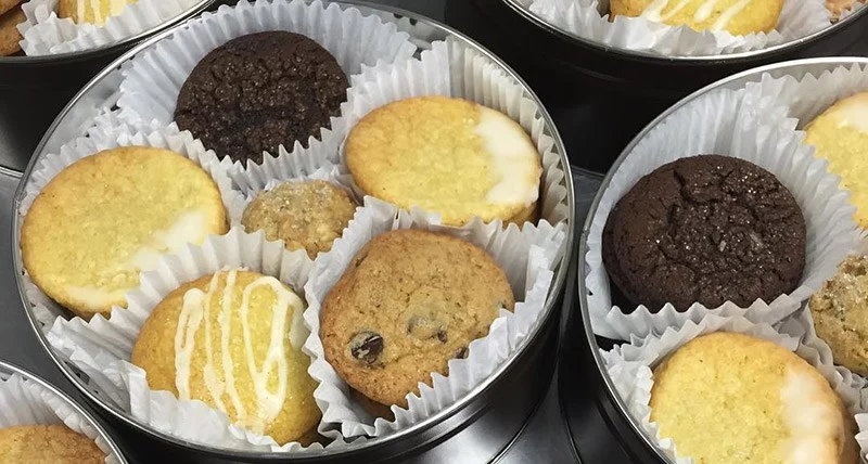 cookie tin filled with several cookie flavors to be sent as a corporate gift