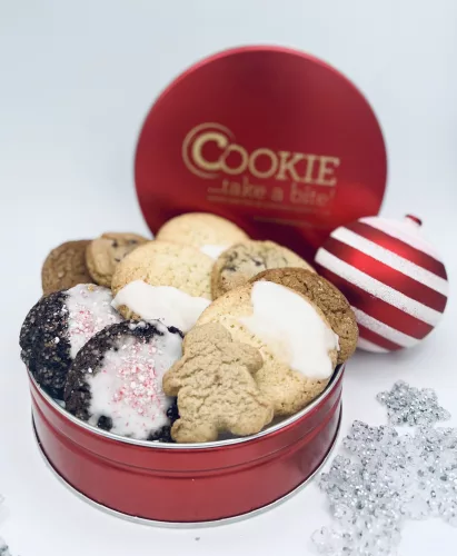 open cookie tin overflowing with a variety of cookies, holiday ornament 