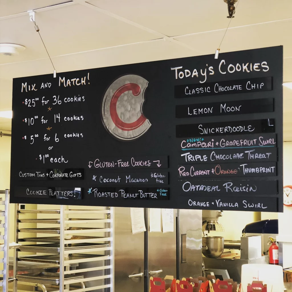 view of the interior of the bakery at COOKIE...take a bite focusing on the menu of today's available cookies