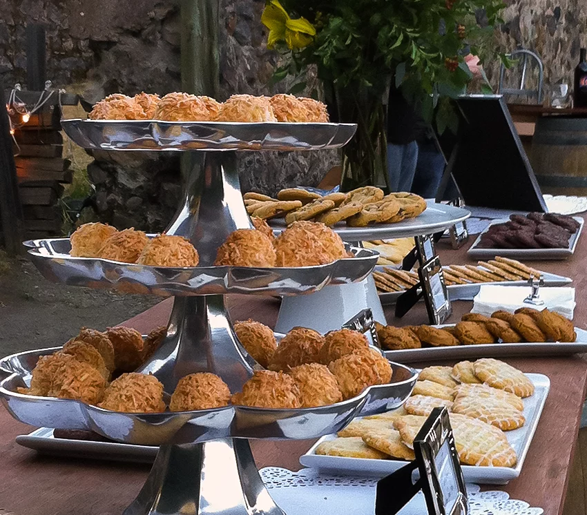 A beautiful cookie display at a wedding with multiple fresh baked cookies