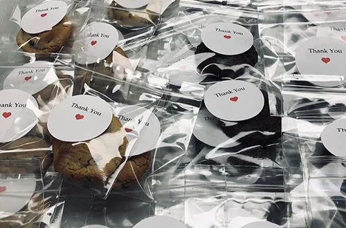 packaged cookie party favors with a thank you messages printed on the front
