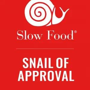 Snail of Approval badge from Slow Food with white snail on red background