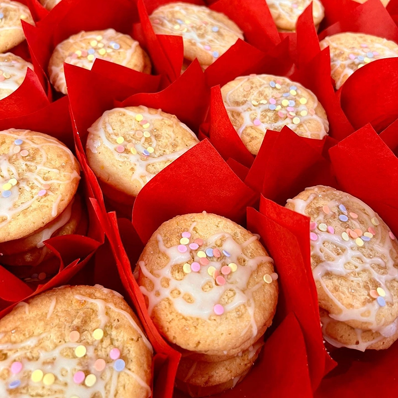 freshly baked Easter confetti sugar cookies wrapped in red tissue