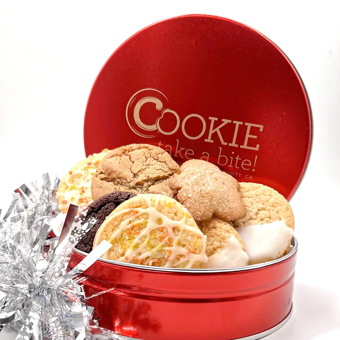 A deluxe holiday cookie gift tin, featuring over 18 natural cookies in seasonal flavors.