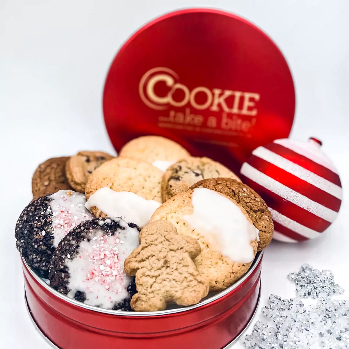 A platinum cookie gift tin, with over 42 all natural cookies in seasonal holiday flavors.