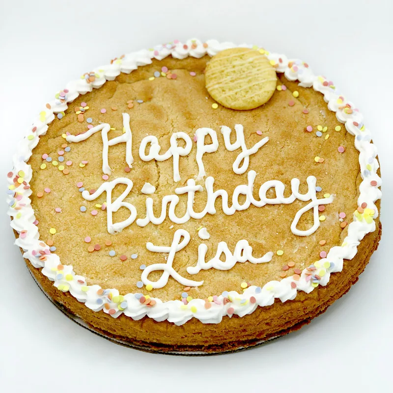 A custom cookie birthday cake against a white background.
