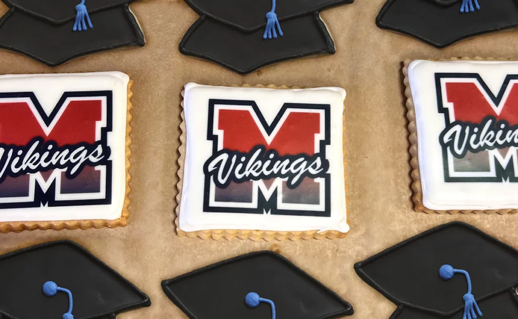 A tray of custom sugar cookies for a graduation celebration.